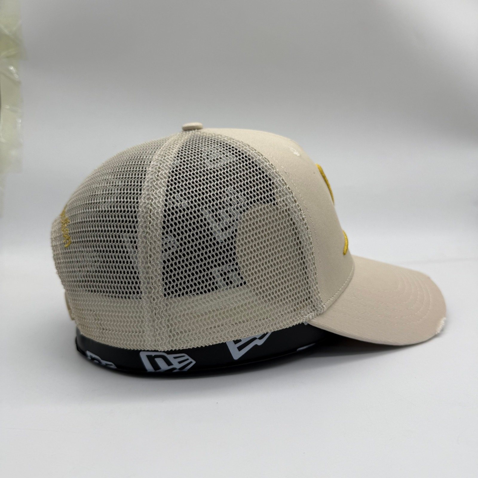Ivory stone Dinero trucker cap side profile with cream mesh
