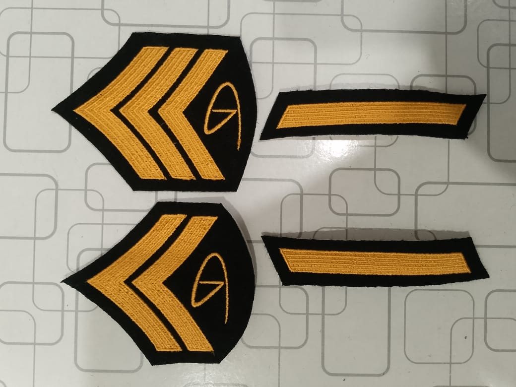 Gold and black Dinero insignia patch